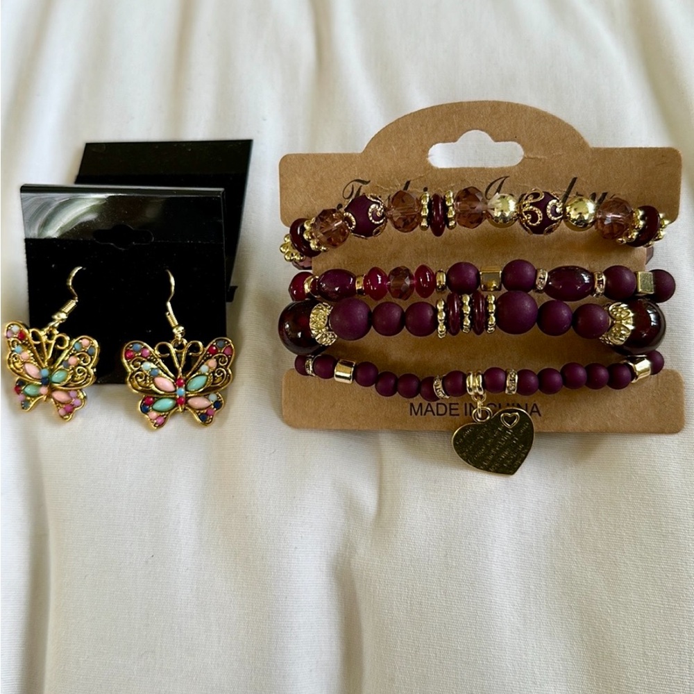 Bundle of gold tone beaded bracelets and butterfly stone earrings
